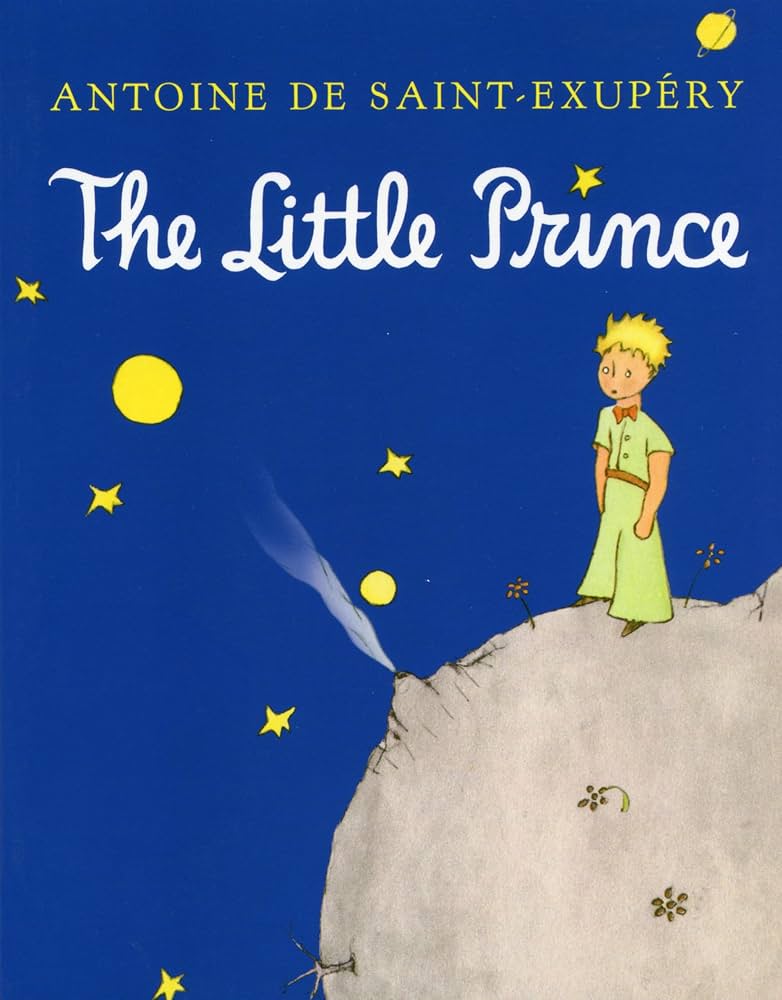 Book cover for The Little Prince: blue background with yellow stars, the Little Prince standing on his small asteroid, title 'The Little Prince' and author 'Antoine de Saint-Exupéry' at the top.